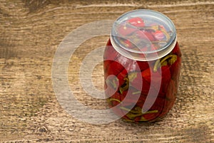 Red and hot peppers preserved in vinegar