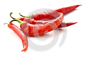 Red hot peppers on white background