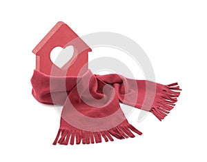 Red house with heart wrapped in a scarf