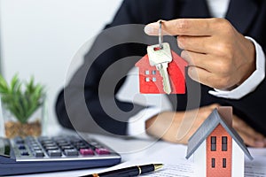The red house key in the hand of the agent Real Estate Concepts, Real Estate Sales, Residential Rental, Buying Apartments, Selling