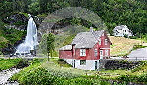 Red house near Steinsdalsfossen waterfall