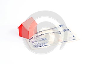 Red House paper and Japan money banknote for loans concept