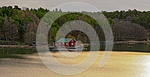 Red house on rocky shore of Ruissalo island, Finland