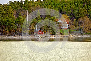 Red house on rocky shore of Ruissalo island, Finland