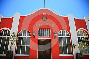 Red house traditional house with a blue sky in Luderitz