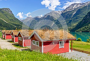 Red houses, camping on the lake Lovatnet, Norway