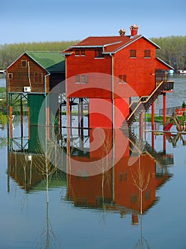 Red houses and flooding river