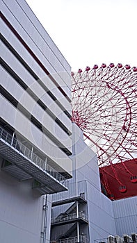 Red huge wheel ferris building in Japan Osaka