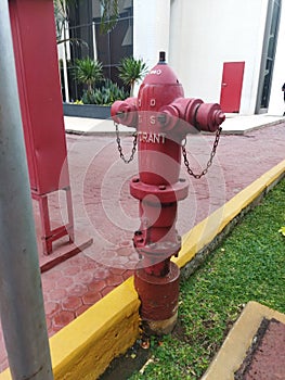 red hydrant in front of a building