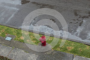 A red hydrant with long exposure rain pool in rainy day