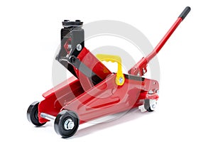 Red hydraulic floor jack isolated on white background