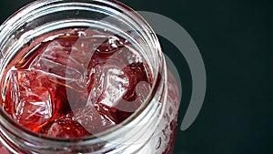 Red ice cold drink glass jar top view