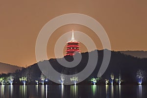 Red illuminated pagoda at West Lake, Hangzhou, China