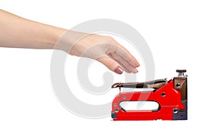 Red industrial stapler, furniture industry hardware. Isolated on white