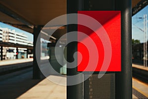 Red information sign board mockup on train station