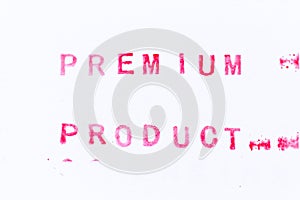 Red ink rubber stamp in word premium product on white paper background