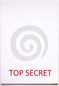 Red inscription TOP SECRET on a white sheet. Secrets and conspiracies. Archives of documents. Financial statements.