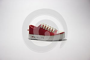 Red insulated sneakers with a white background