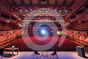 Red interior of empty conference hall.