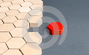 Red item is disconnected from other items. Hexagons. The concept of separating parts from a whole or connecting parts to a whole photo