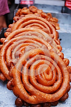 Red JALEBI sweet item: Street food closeup view at Dhaka