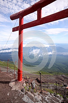 Red Japanese tori gate on top of Mt. Fuji