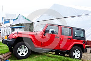 Red jeep on grass