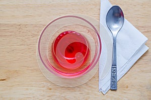 Red jelly in glass.