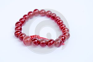 Red Jewellery bracelet armlet on white background