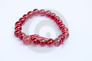 Red Jewellery bracelet armlet on white background photo