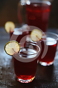 Red juice with lime slices