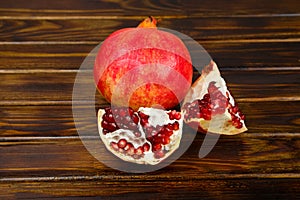 Red juicy pomegranate, whole , half, ripe and broken fruits