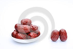 Red jujube with white dish on the white background