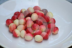 Red karonda on white plate