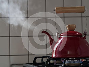 Red kettle steaming hot.