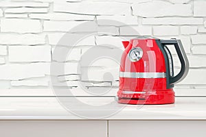 Red kettle in table kitchen room interior