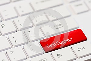 Red key with text tech support on white laptop keyboard