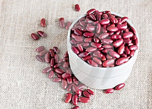 Red kidney bean in white bowl on gunny