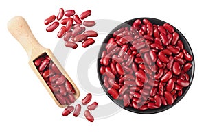 Red kidney beans in black bowl with wooden spoon isolated on white background. top view