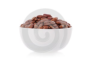 Red kidney beans in a bowl on white