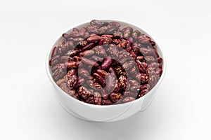 Red kidney beans in white bowl isolated white background