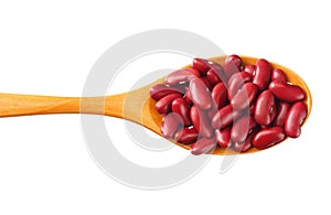 red kidney beans in wooden spoon isolated on white background. top view