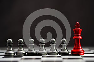 Red king chess with others black pawn chess for leader and different thinking.Disrupt concept.