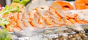 Red king shrimp farm prawns on ice substrate market counter