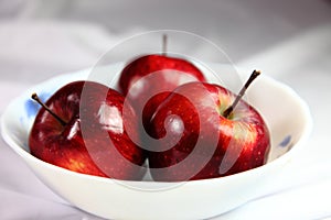 Red kinnaur apples in bowl