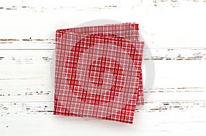 Red kitchen cloth on white vintage wooden table. copy space