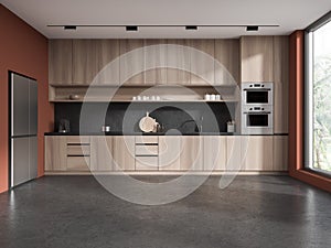 Red kitchen interior with cabinets and fridge