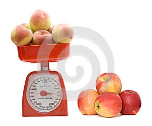 Red kitchen scale weighting peaches