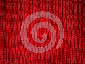 Red knitted fabric macro photo as a background