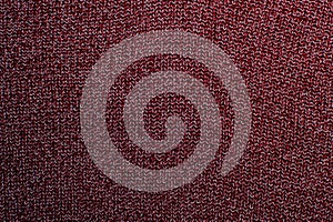 Red knitted fabric texture, closeup